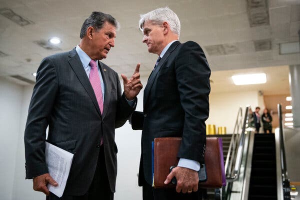 Senator Joe Manchin, Democrat from West Virginia, and Senator Bill Cassidy, Republican from Louisiana, in the Capitol in May following a vote.