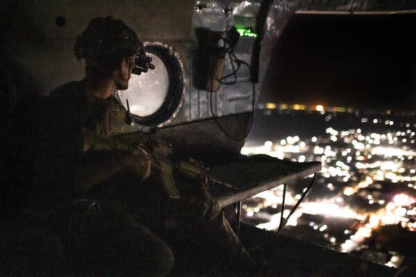 An Afghan soldier flying over Helmand Province last month. Recent C.I.A. and military intelligence reports on Afghanistan have been increasingly pessimistic, highlighting gains by the Taliban.