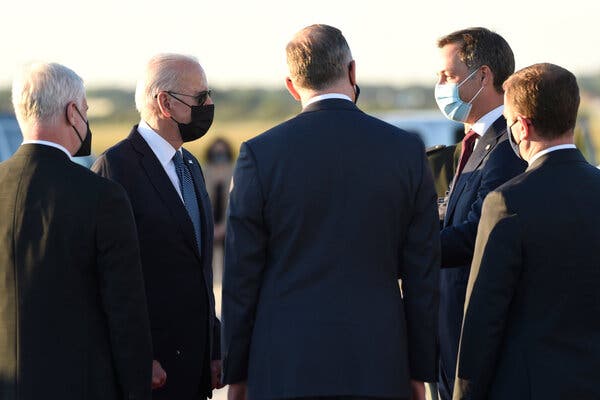 President Biden is welcomed by Prime Minister Alexander De Croo of Belgium in Brussels on Sunday.