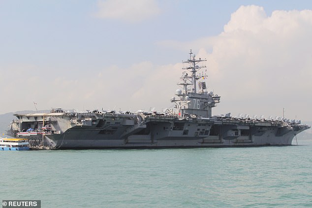 A U.S. aircraft carrier group led by the USS Ronald Reagan (pictured in 2018, file photo) has entered the South China Sea as part of a routine mission, the U.S. Navy said on Tuesday