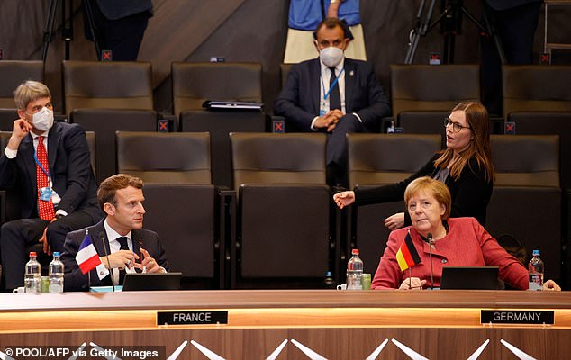Some allies bristled at the Nato effort to speak out on China. German Chancellor Angela Merkel (pictured right with France's Emmanuel Macron) said Nato's decision to name China as a threat 'shouldn't be overstated' because Beijing, like Russia, is also a partner in some areas
