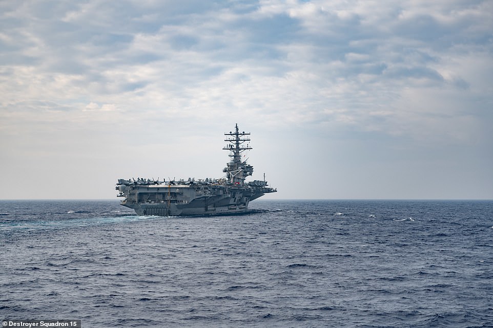 The Nimitz class aircraft carrier USS Ronald Reagan (CVN 76) conducts routine operations last last month. The Ronald Reagan is forward-deployed to the South China Sea for strike exercises