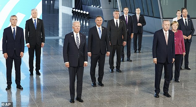 NATO leaders said they would work together to counter the 'systemic challenges' posed by Beijing's policies, as US President Joe Biden (pictured third from left) renewed Washington's transatlantic ties at his first summit with the allies.