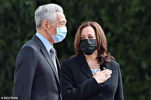 Vice President Kamala Harris has boasted that 'the US is a global leader' and vows 'enduring engagement' in Asia after arriving in Singapore (pictured with Prime Minister Lee Hsien Loong)